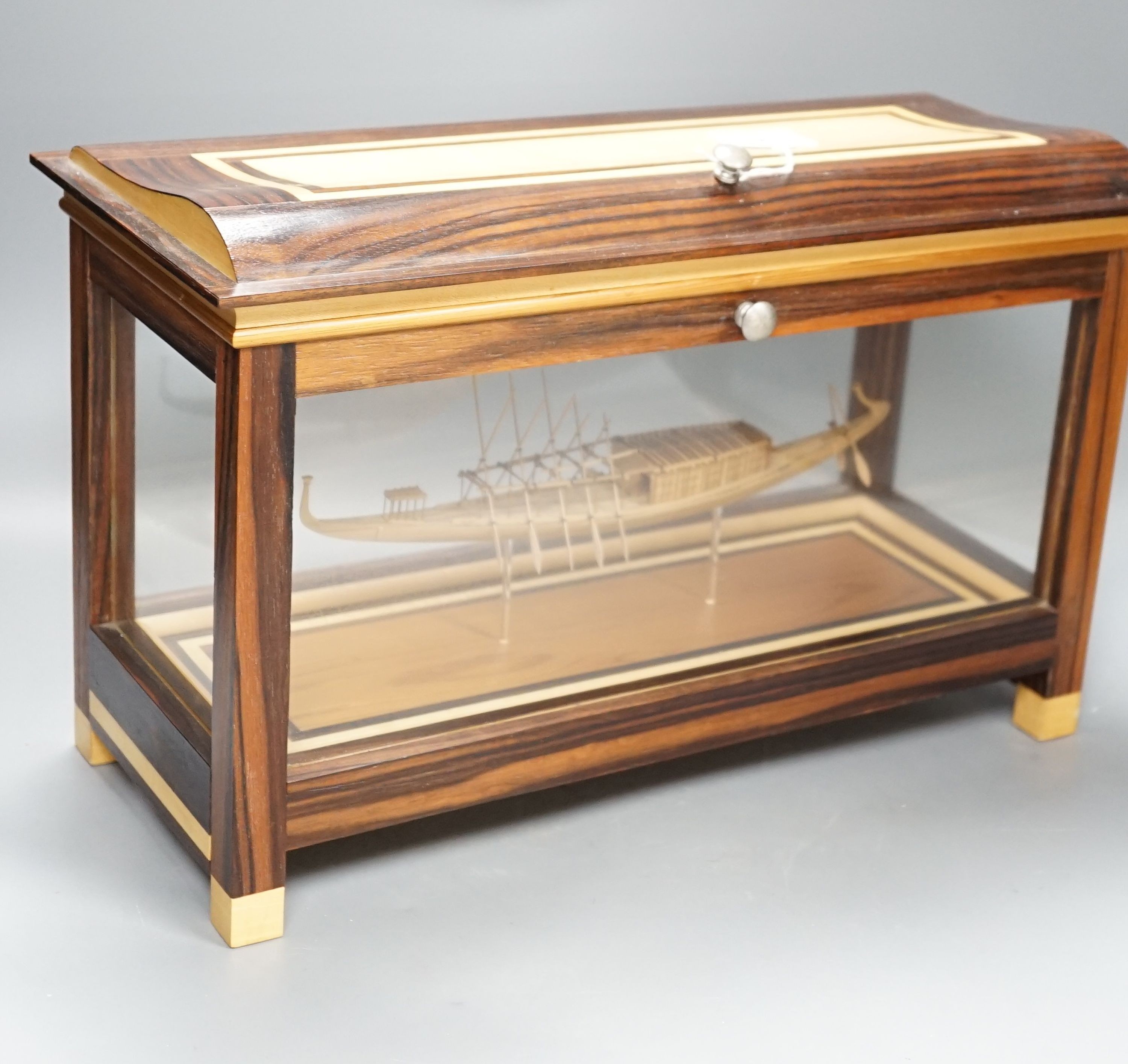 A calamander cased model of an Ancient Egyptian barge, width 42 cms